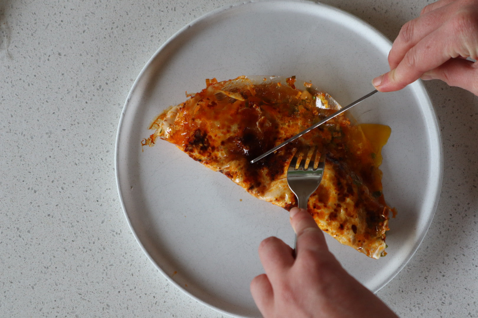 A delicious picture of a Rice Paper Omelette with White Mausu Extra Hot Peanut Rāyu. 