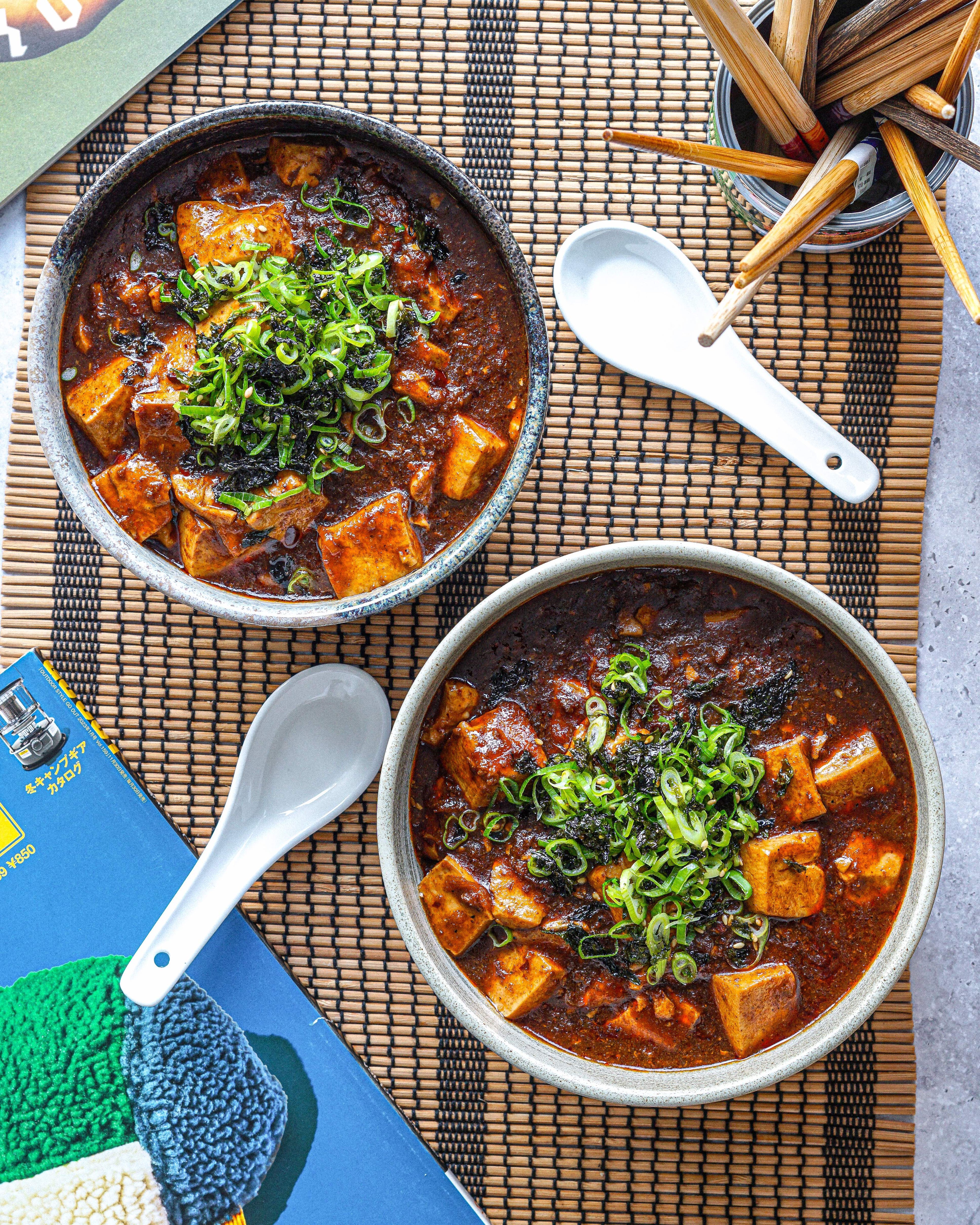 Two bowls of Mapo Tofu in a spicy White Mausu Smoky Chilli Oil infused ramen. 